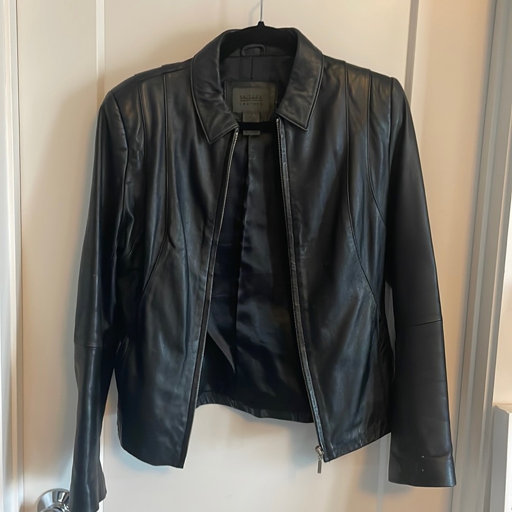 Excellent condition black leather jacket. Zip up.
